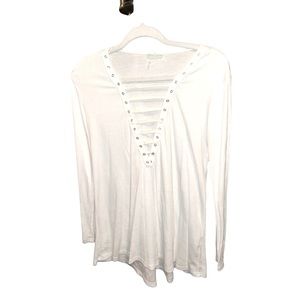 White tunic style top with multiple cut outs in the front. Size Small.